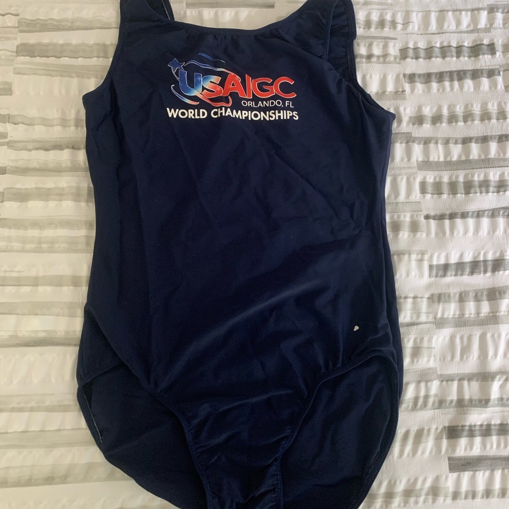 Navy leotard with red, white, and blue writing in size X-Large (XL)